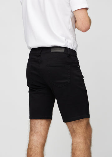 Sorte middle-slim shorts set bagfra tæt på for at vise detaljer.